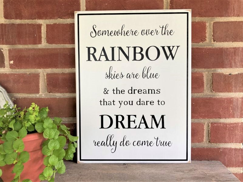 White, worn finish sign with black lettering saying, Somewhere Over The Rainbow Skies are Blue... Inspirational Wizard of OZ wood sign. Sign available in two sizes. 12x16 inches or 16x24 inches. Choice of colors.