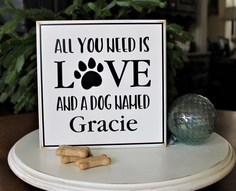 Custon Dog Sign.  White worn finish with black lettering that says All you need is love and a dog named (your dogs name) Available in 2 sizes. 