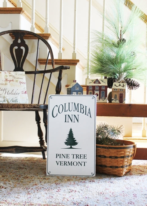 Columbia Inn Pine Tree, Vermont A tribute to White Christmas, this charming wood sign has a worn white finish with dark green lettering. A special addition to your Christmas decorating. Two sizes available. 12x20 or 16x27 inches.