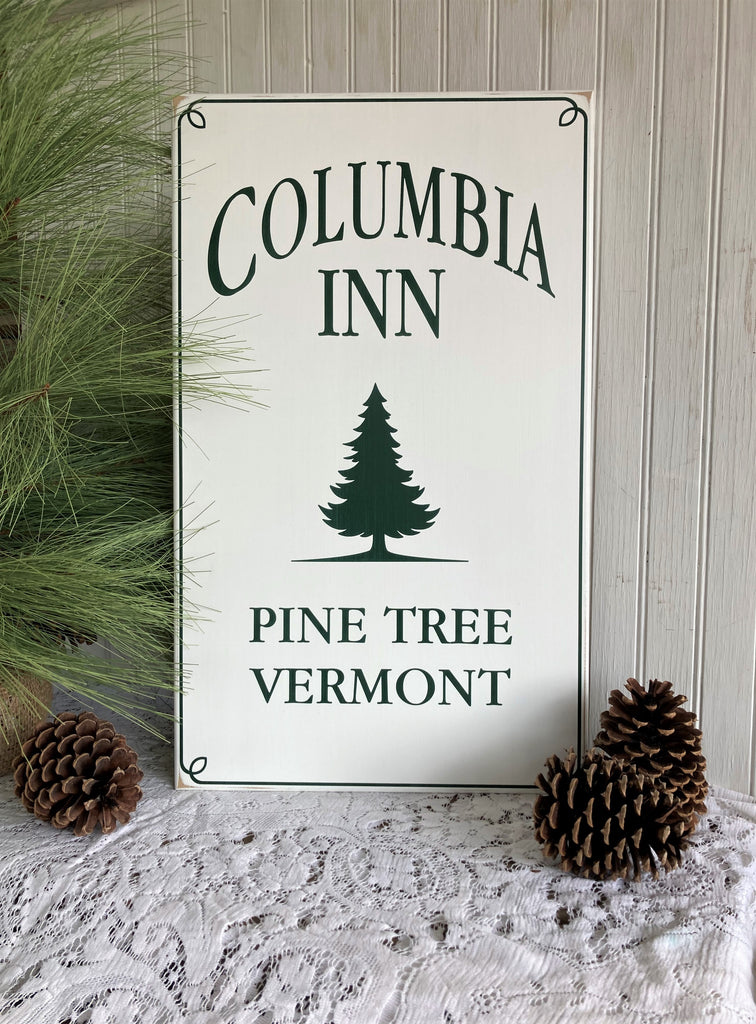 Columbia Inn  Pine Tree, Vermont  A tribute to White Christmas, this charming wood sign has a worn white finish with dark green lettering.   A special addition to your Christmas decorating.  Two sizes available. 12x20 or 16x27 inches.