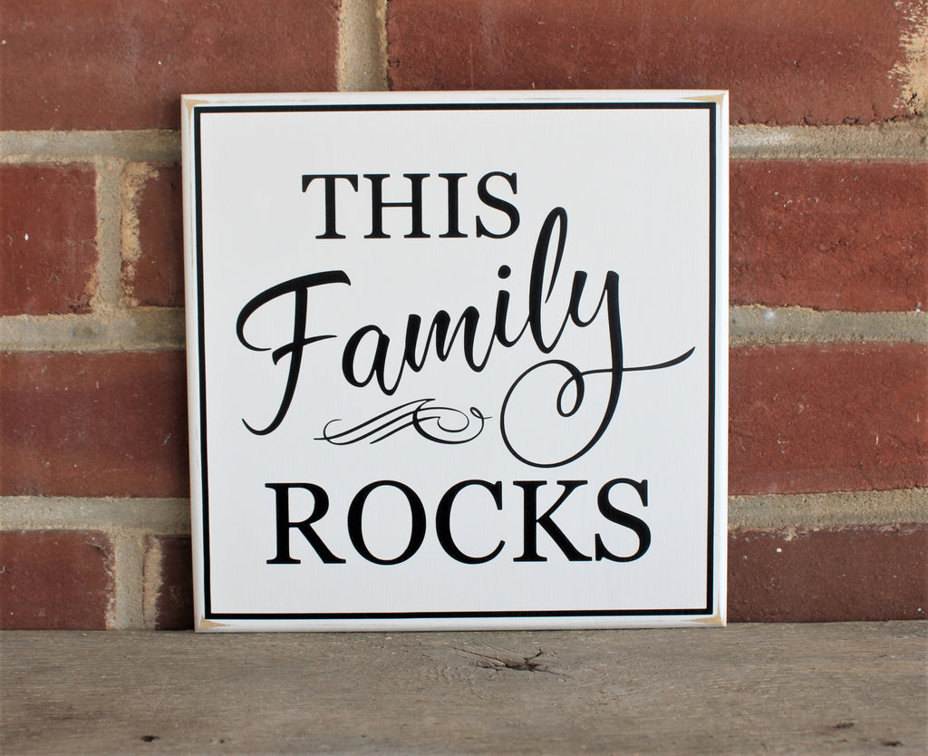 Square white worn finish wood sign with the saying This Family Rocks in black. Available in 2 sizes and choice of colors. 