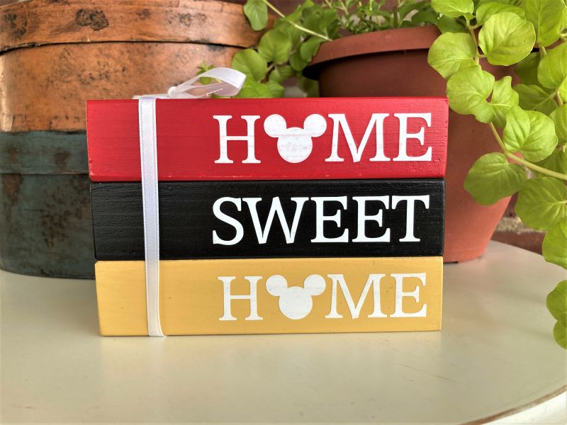 Home Sweet Home Mouse Blocks Whimsical  set of 3 wood blocks glued together and tied with a bow. Red, Black and Yellow blocks with white lettering. Faux book stack. 3 1/2 inches tall, 5 inches across and 2 1/2 inches deep.