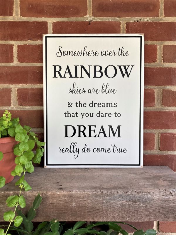 White, worn finish sign with black lettering saying, Somewhere Over The Rainbow Skies are Blue... Inspirational Wizard of OZ wood sign. Sign available in two sizes. 12x16 inches or 16x24 inches. Choice of colors