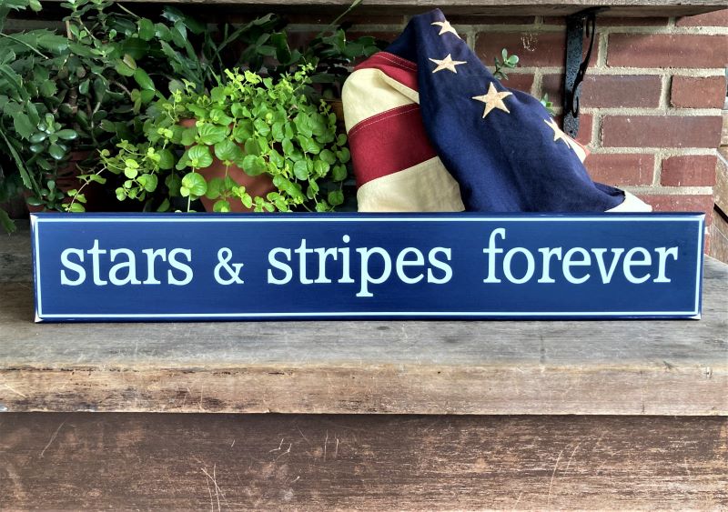 4x24 inch wood sign painted dark blue with white lettering saying stars and stripes forever. Patriotic decor.