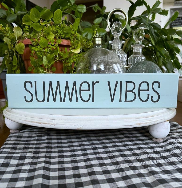 Aqua stained sign block with black lettering  saying summer vibes