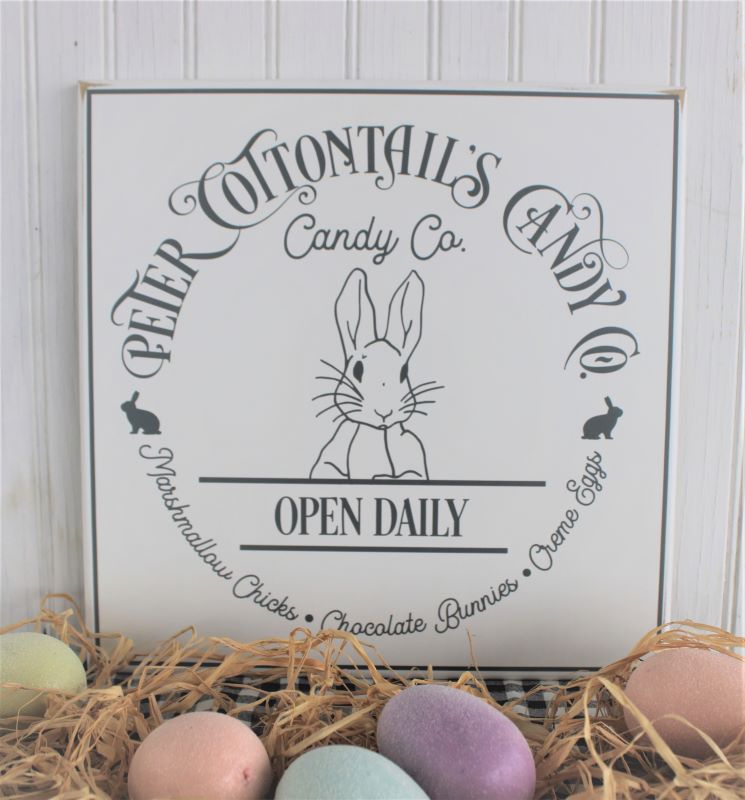 Peter Cottontail's Candy Co. 12x12 inch sign.  Worn white  finish with gray lettering.  Sweet bunny face in the center of the sign. Country Workshop Signs 